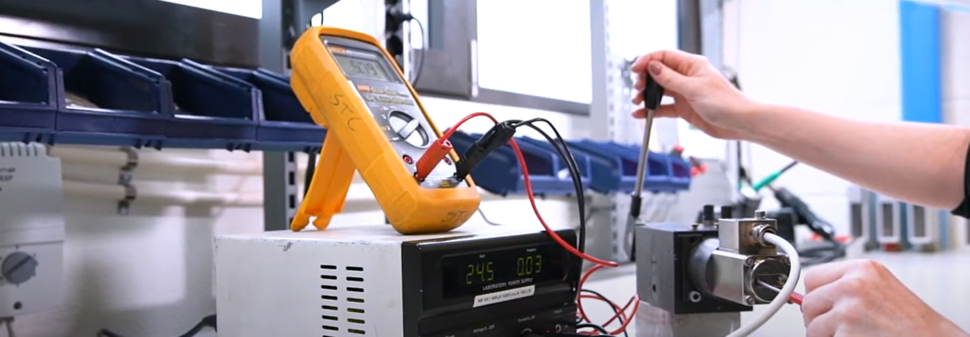 Image of SAC in use at a workshop, with equipment in the background, demonstrating a practical application of the product.