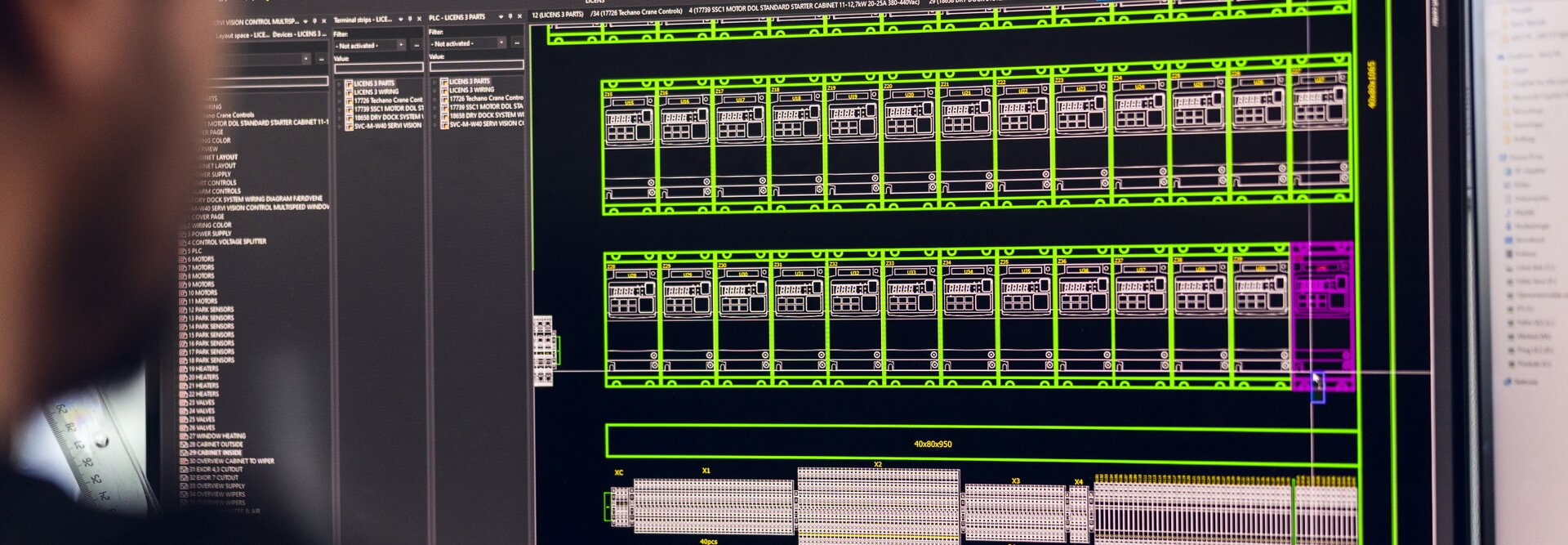 A computer screen displays a detailed layout of an electrical cabinet with components and wiring in a technical software | © Øyvind Welle